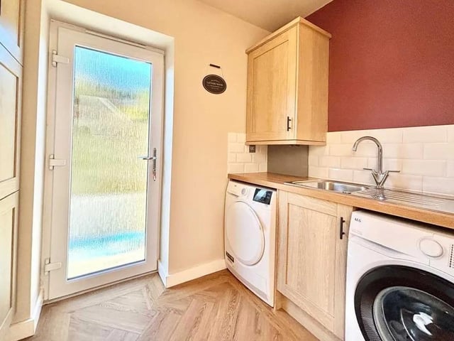 The utility room offers a separate space for all your laundry requirements with the added benefit of storage space and offers access to the side elevation.