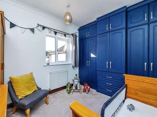 The fourth and final bedroom is a colourful number, with extensive, built-in storage