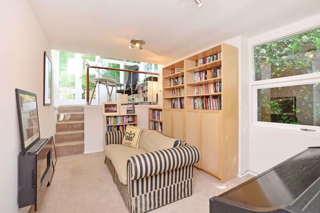 Well-presented with a small flight of stairs leading to a mezzanine home office, with glazed windows to four sides.