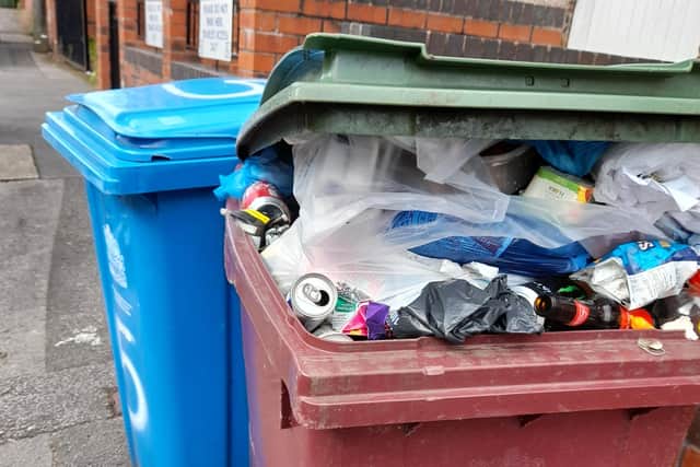 An overflowing bin on Bentinck Street. Residents say this common occurrence may be one of the causes of vermin. (Image: submitted)