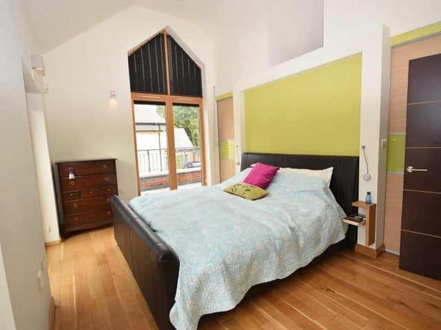 The elegant principal bedroom at the £749,500 property is distinguished by double doors that open on to an amazing balcony. Other features include a vaulted ceiling, two walk-in wardrobes, two column radiators and a floor of solid oak wood.
