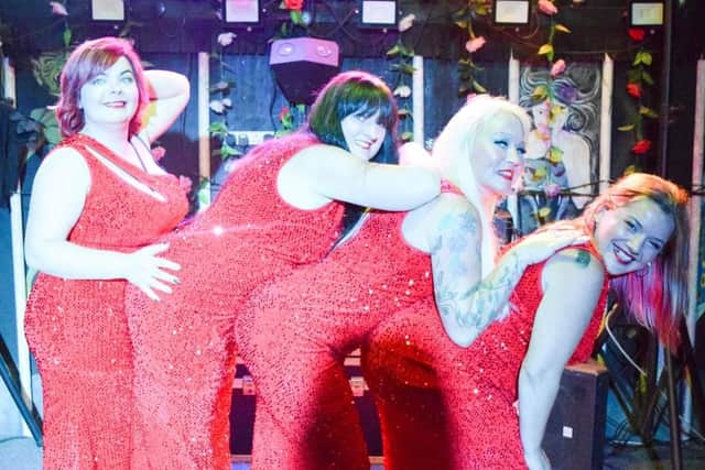 A photo by Glitterbug Photography of one of the troupe's performances.