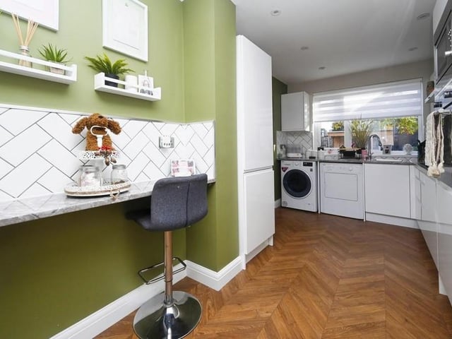 Moving into the kitchen, which has everything you need, including a seating area for breakfast and snacks. Appliances include a built-in oven, microwave and hob with extractor over, and an integrated fridge/freezer. There is space for a washing machine and dryer.