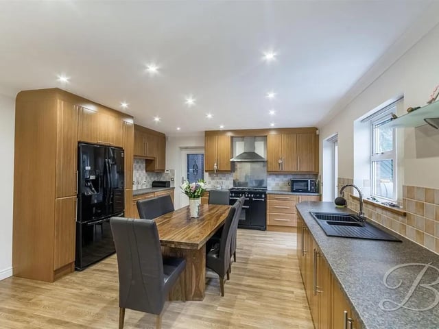 The kitchen is complete with a range of matching cabinetry with ample worktop space with an inset sink and drainer. This area also lends itself as a dining area with space for a dining table and chairs.
