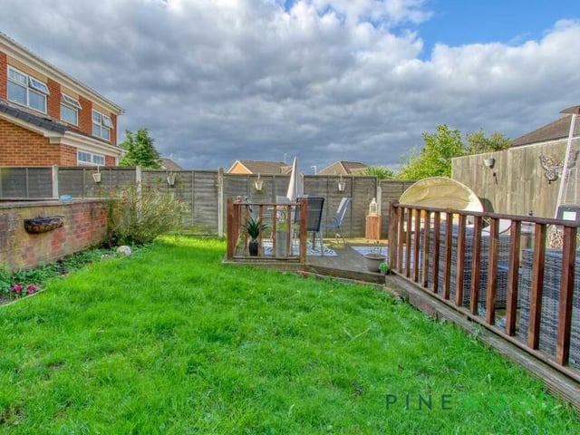 Much of the rear garden is laid to lawn.