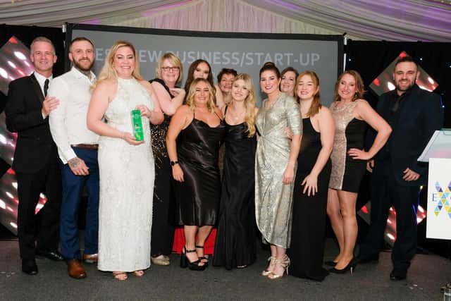 Kelly Wilson Parkes holding the best new business/start up trophy at last year's Chad Business Excellence awards along with the team at Flowers by Touch of Charm, presented by Gary Blurton, National World central regional director, leftCentral Region far left. (Photo by: Dean Atkins Photography)