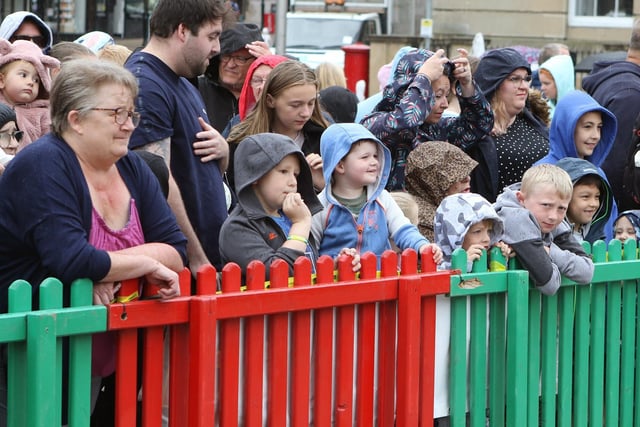 Dinosaur day attracted hundreds of families, despite the rain.