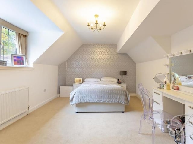 Within the roof space on the first floor is the annexe's bedroom, the fifth in the Mansfield property. The floor is carpeted and the window faces the back of the house.