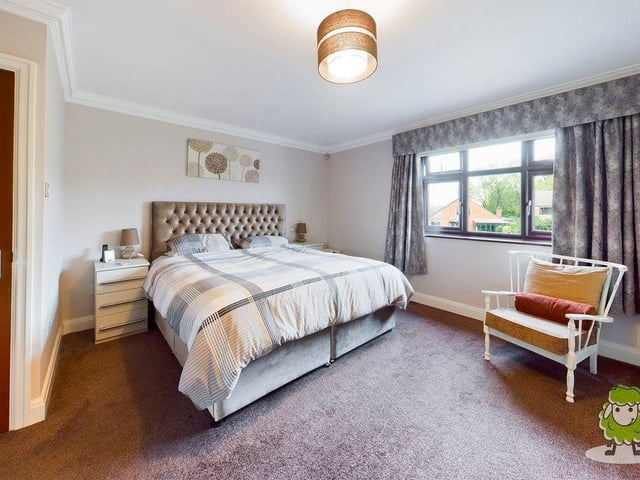 And so to the main, and largest, bedroom, which has an en suite bathroom. It's a double, with a window overlooking the front of the property, and also new wardrobes that have only just been fitted by the current owner.