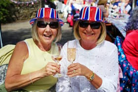 Janet and Debbie Broadhurst celebrate the coronation at a street party in Teversal.