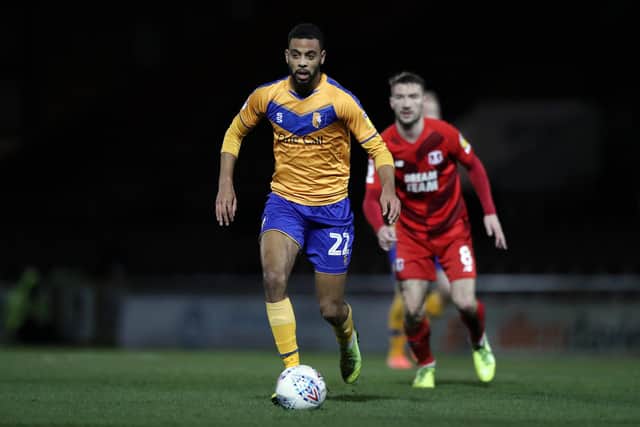 CJ Hamilton runs with the ball during the Sky Bet League Two match between Leyton Orient and Mansfield Town at The Breyer Group Stadium on February 11. (Photo by Naomi Baker/Getty Images)