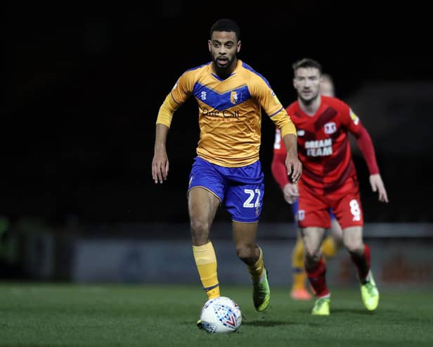 CJ Hamilton runs with the ball during the Sky Bet League Two match between Leyton Orient and Mansfield Town at The Breyer Group Stadium on February 11. (Photo by Naomi Baker/Getty Images)