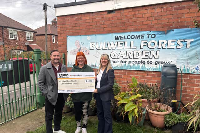 The team at the Wilkins Group handing the cheque to Barbara Bates, operational manager and Forest School practitioner (centre)