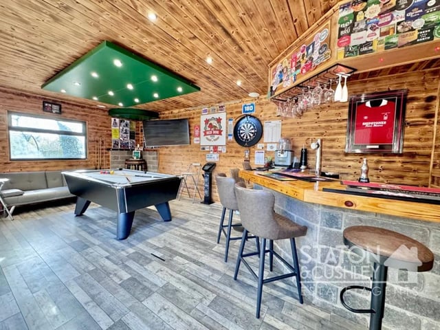 The bar is the perfect place to unwind, enjoy a game of pool or entertain guests.