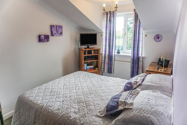 The master bedroom has an en-suite shower room. There are a further three double bedrooms.