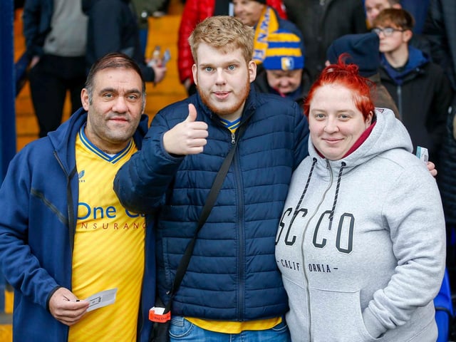 Mansfield Town fans enjoy the win at Stockport County
