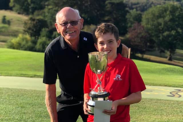 Albi Walker with NUGC deputy president Richard Bonello and his trophy.