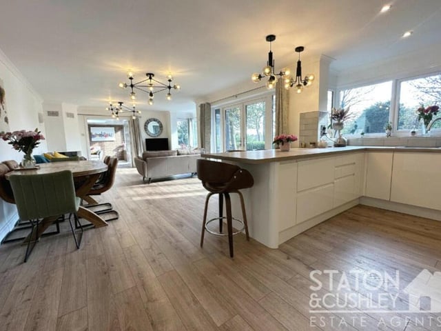 Here is the kitchen section of the main open-plan room at the Chesterfield Road South home. It is fitted with wall and base units and roll-edge work surfaces, with a one-and-half-bowl sink.