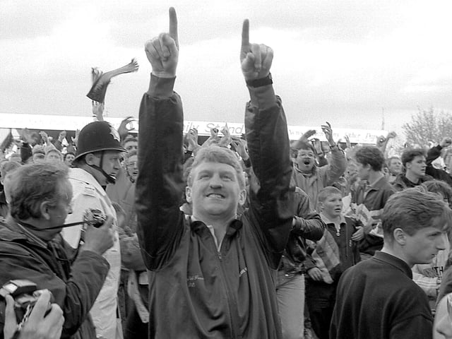 Manager George Foster acknowledges the fans.