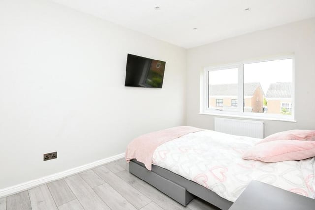The crisp and clean second bedroom at the £310,000 Kirkby house overlooks the back garden. All four bedrooms feature double integrated wardrobes.