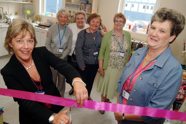 King's Mill Hospital volunteers relaunched the Charity Shop in 2008. Trust chairman Tracy Doucet, left, cut the ribbon with Charity Shop co-ordinator Eve Booker, right, watched by Charity Shop volunteers, from the left; Marjorie Grice, Mary Abell co-ordinator, Sheila Whalley and Barbara Lewis.