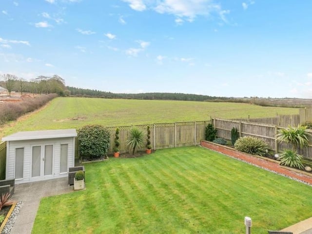 The view from one of the first-floor bedrooms at the £635,000 property. Beyond the enclosed back garden is open Mansfield countryside.