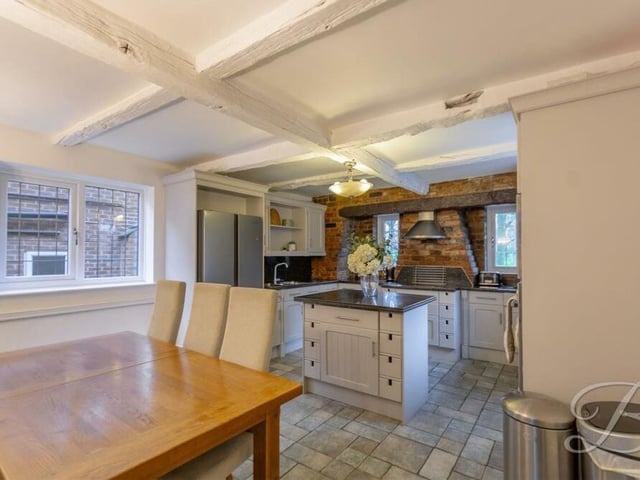 The kitchen doubles up as a dining room, with plenty of space for a dining table for family meals or for entertaining guests.