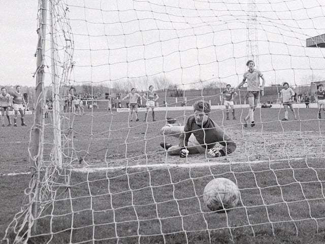 John Dungworth slots home the winning penalty at home to Swindon Town.