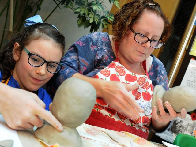 Mud heads challenge Mansfield Museum. Katie Payton, 9, and her mum Rachel  work on their heads as team Peculiar Paytons in 2017.