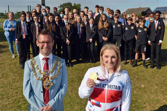 Pupils at All Saints Catholic Academy greet Mansfield's Paralympic star Charlotte Henshaw and Mayor, Andy Abrahams, during an event at the school last September.
