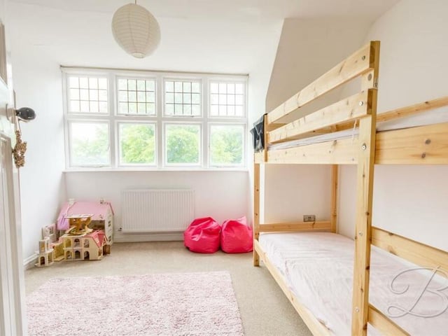 Three more sizeable bedrooms on the second floor of the house are headed by this one. It has feature windows overlooking the front garden.