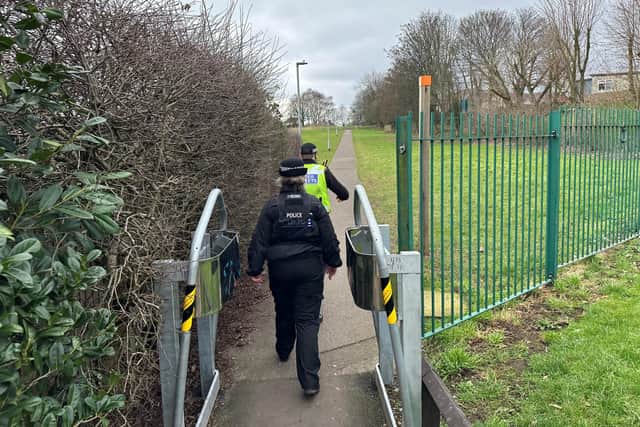 A police officer and member of Ashfield Council’s community protection team patrol the alley off Bentinck Street after the meeting
