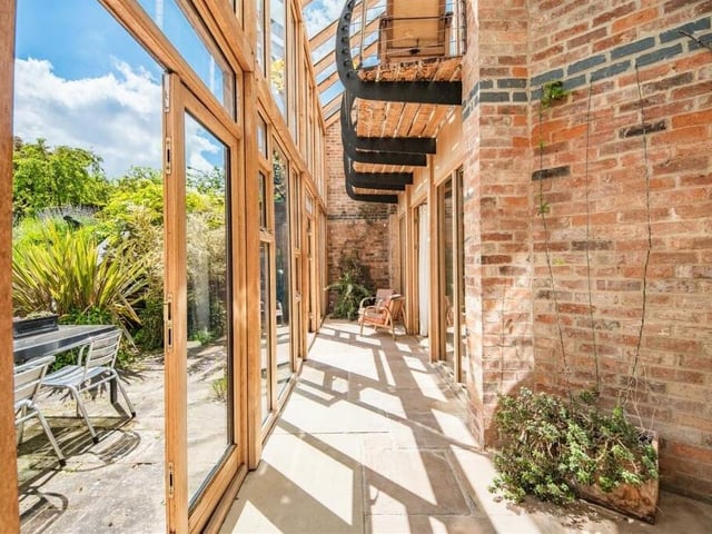 An example of the property in its glass-fronted glory, connecting the exterior to the interior.