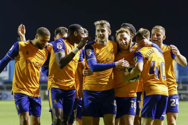Mansfield Town celebrate during their convincing win at Carlisle United.