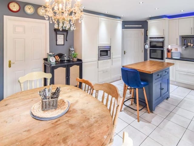 A second shot of the kitchen/diner which, with its tiled flooring and smart worktops and units, is a place that oozes style.