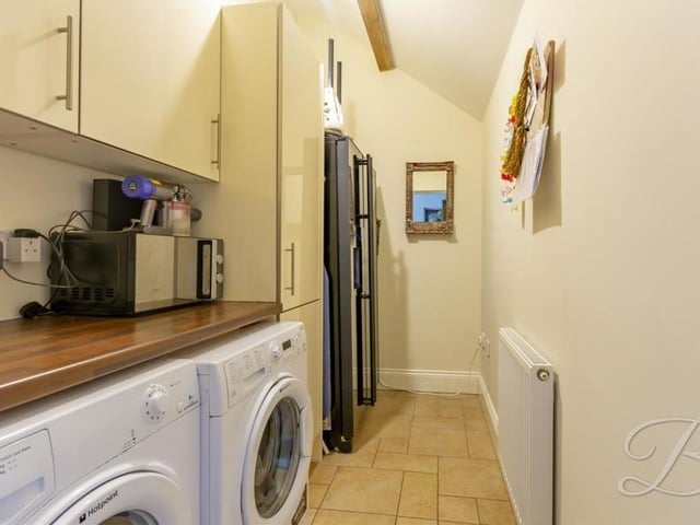 The utility room is  a handy asset to the Sookholme property. There is space and plumbing for a washing machine and tumble dryer, while cabinets offer plenty of storage and work surfaces are useful too.