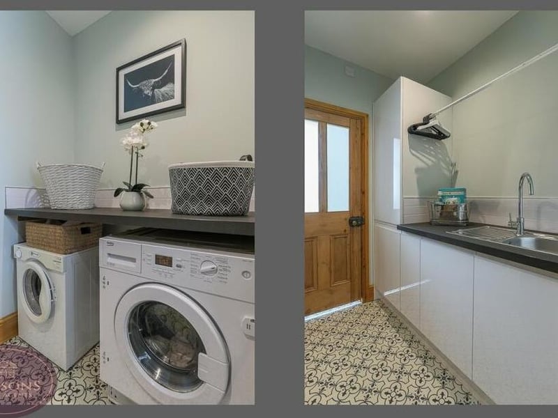 Not far from the kitchen is this useful utility room, with space and plumbing for a washing machine. There is a range of matching wall and base units, with an inset stainless steel sink and drainer unit.