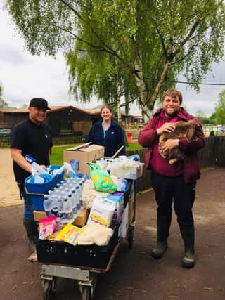 Anna Davis (centre) presents voluteers at Willow Tree Family Farm with some of the goods she has collected from generous Mansfield Woodhouse folk.