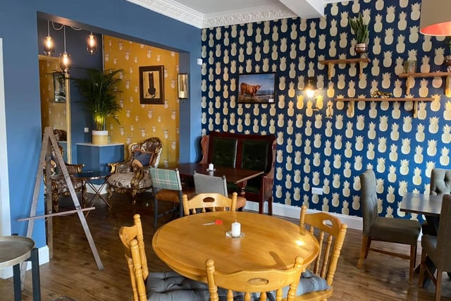 The coffee shop is a hard one to miss with its pineapple and stag print wallpaper. Owners Nick and Gary Passey decorated the place themselves.