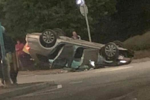 The car flipped onto its roof. Photo by Sam Howlett.