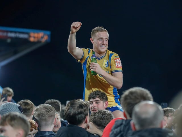 Mansfield Town's fans and players celebrated promotion to League One long into the night.