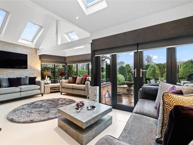 This room is bathed in naturak light and features patio doors leading into the garden, double glazed windows to the side and rear aspects, five feature velux windows with volted ceiling, tiled flooring, opening to the dining room and a radiator.