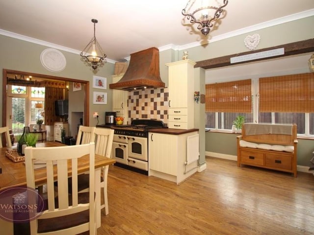 Next stop is the open-plan kitchen/diner, which also has a separate sitting area. It features an argon cooker with extractor over, and an integrated dishwasher.