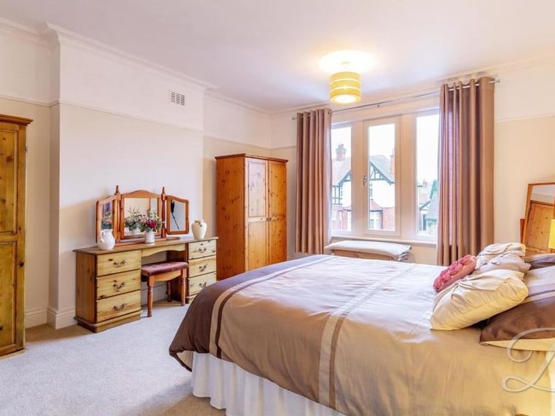 This double bedroom has plenty of space for wardrobes and even a dressing table. The window faces the front of the Edwardian property.