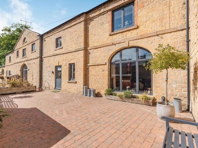 Our photo gallery continues outside now. The front garden is fully landscaped in block paving with ample space to keep potted plants.