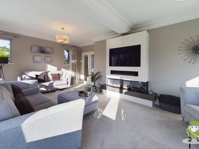 A closer look at the modern feature fireplace in the lounge.