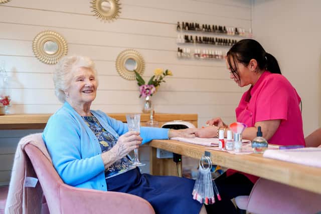 An Ashmere Notts Resident enjoying use of the onsite Nail and Prosecco bar.