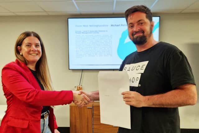 James receives his certificate from Laura Johston, the Chair of Derbyshire and Nottinghamshire CIPD
