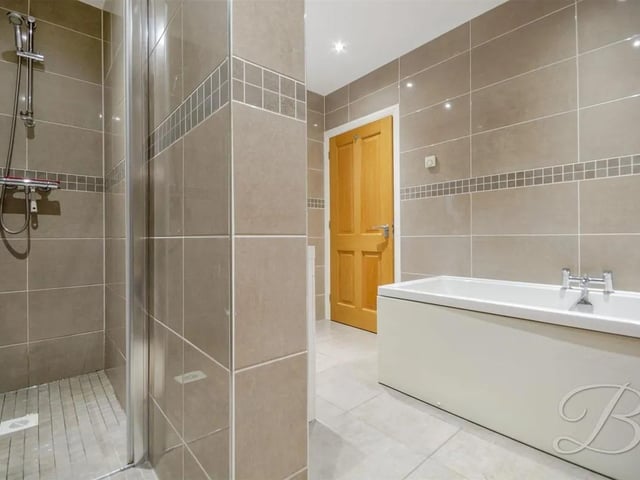 Modern four piece suite with shower, low flush WC, bath and hand wash basin. The bathroom also benefits from underfloor heating.