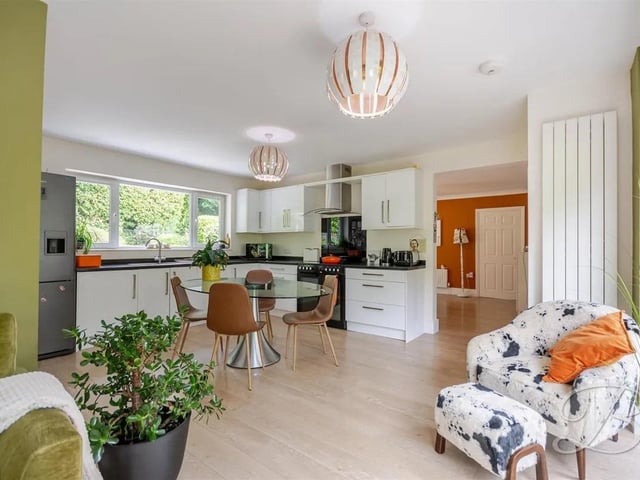 The stunning open-plan kitchen, dining and sitting area is the hub of the home